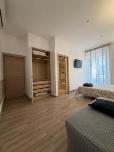 a room with a bed and a walk in closet at Dimora Vaticano apartments in Rome