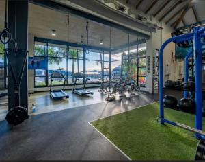 a gym with a bunch of equipment in a room at 832 Villa in Ballito
