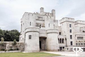 an old stone building with a gate in front at Bastian Gate Gosford Castle 