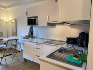 a kitchen with a sink and a counter top at Casa Chiara in Riva del Garda
