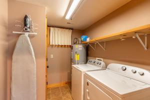 a laundry room with a washer and dryer at Altitudes Attitude in Blowing Rock +27 photos