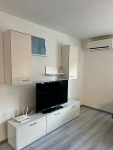 a white living room with a flat screen tv at Apartment Lana Vareš in Vareš