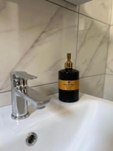 a bottle of soap sitting on top of a bathroom sink at Apartment Lana Vareš in Vareš