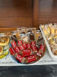 a table topped with a plate of different types of pastries at La Convenienza in Cascina