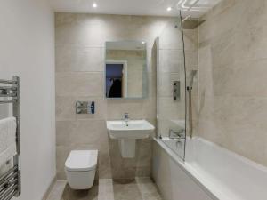 a bathroom with a sink and a toilet and a shower at 2 Bed in Bude 90096 in Bude +28 photos