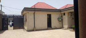 a house with a tile roof and a driveway at Arhiba Guest House አርሂባ እንግዳ ማረፊያ  +9 photos