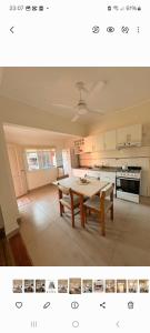 Una sala de estar con una mesa y una cocina. en LodeMingo, en San Pedro 5 fotos más