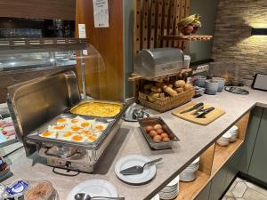 a kitchen with some food on a counter at Hotel Fürstenhof in Braunschweig