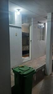 a room with a mirror and a room with a bed at Mini Apartamento acogedor in Miraflores