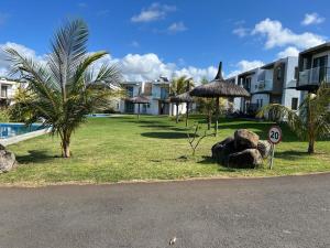 a view of a resort with a pool and a sign at Heaven on earth! in Grand Gaube