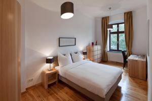 Postel nebo postele na pokoji v ubytování Luxoise Apartments