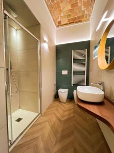 a bathroom with a sink and a shower at Residenza Veneto 80 in Vasto +43 photos
