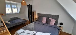 a bedroom with a bed and a bunk bed at Séjournez avec le Mont-Saint-Michel en toile de fond 8 pers in Huisnes-sur-Mer