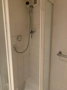 a bathroom with a shower with a shower at The Lord Nelson Inn in Marshfield