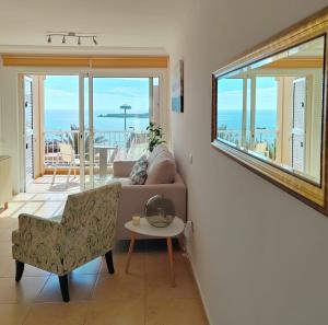 a living room with a couch and a table at Casa Poris in Poris de Abona