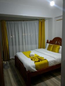 Ένα ή περισσότερα κρεβάτια σε δωμάτιο στο Shiku's Homestay