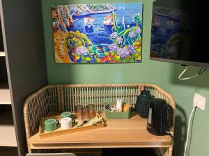 a wicker table with items on it in a room at Rosso di Piera Rooms in Arluno
