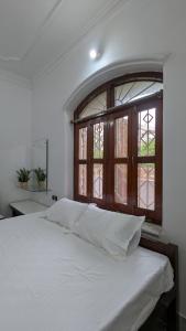 Ένα ή περισσότερα κρεβάτια σε δωμάτιο στο Entire Villa in Darbhanga