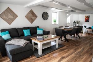 a living room with a couch and a table at Ferienhaus Lotte in Vöhl