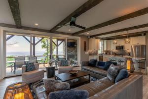 a living room with a couch and a table at Mountain Kandy at Blue Ridge Mountain Club in Stony Fork