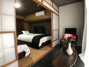 Postel nebo postele na pokoji v ubytování OZ nikko