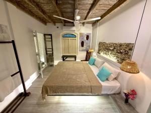 a bedroom with a bed in a room at Sudu Colonial House 1929 in Ambalangoda +72 photos