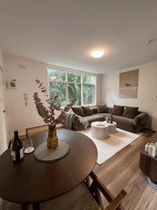 a living room with a table and a couch at Fulton Flow Resort Apartment in Melbourne