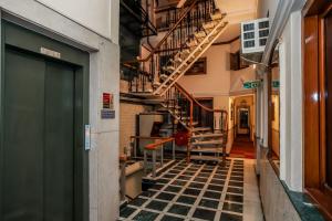an empty hallway with stairs in a building at asar CP Outer Circle by Orion Hotels in New Delhi +97 photos