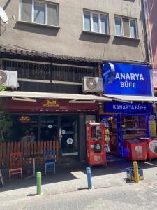 a shop with a blue sign on the side of a building at An Unforgettable Experience in Istanbul