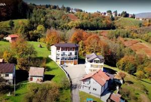an aerial view of a house in a village at Apartmani TOKI in Mrkonjić Grad