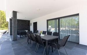 a dining room with a table and chairs at Villa Vanja in Imotski