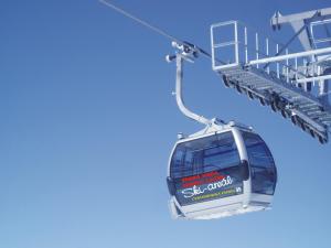 a ski gondola lifts up into the sky at Penzion Martin in Janske Lazne