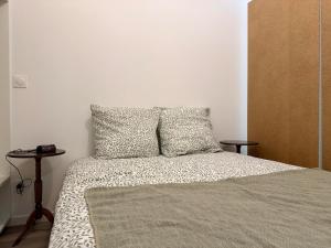 En eller flere senge i et værelse på Appartement Cosy Bord de Lac