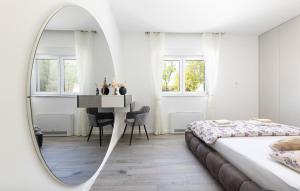 a bedroom with a bed and a mirror and a desk at Villa Vanja in Imotski +34 photos