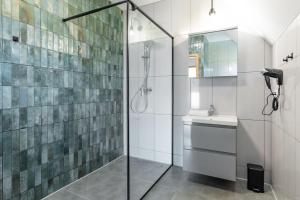 a bathroom with a shower and a sink at Villach in Bukowina Tatrzańska +12 photos