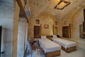 En eller flere senge i et værelse på Vefa Konagı