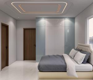 a bedroom with a bed with a ceiling at Luxor in Hyderabad