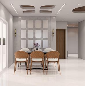 a dining room with a table and chairs at Luxor in Hyderabad