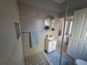 Koupelna v ubytování Tusker House Kruger + 29 fotografií