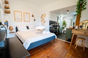 a bedroom with a large bed and a table at LOMA in Hagoshrim +176 photos