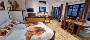 Voodi või voodid majutusasutuse Scafell Cottage on The Big "W" Ranch toas