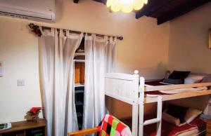 a bedroom with two bunk beds in a room at AsteriA 3D House Inn in Pano Arodes