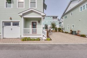 a house with a white gate and a driveway at 410A The Jetty House in Virginia Beach