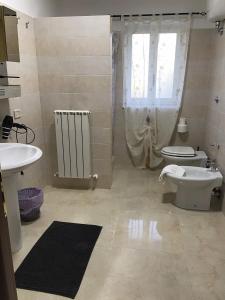 Koupelna v ubytování Vista sul Lago + 19 fotografií