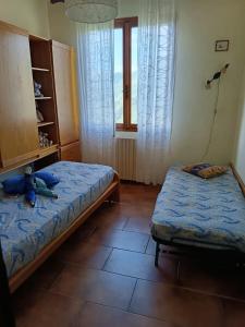 Postel nebo postele na pokoji v ubytování Casa di Isodoru