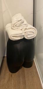 a stack of towels sitting on top of a ottoman at Casa Pilar in Sos del Rey Católico +20 photos