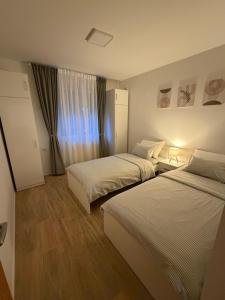 Postel nebo postele na pokoji v ubytování Apartment THEO