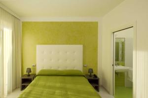 Ένα ή περισσότερα κρεβάτια σε δωμάτιο στο Hotel La Maestra +70 φωτογραφίες