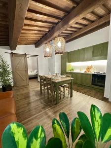 a kitchen and dining room with a table and chairs at Under The Tuscan Sun in Arezzo