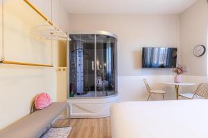 a living room with a table and a dining room at Venus Suite - Romantic Private Spa - Centro Livorno in Livorno